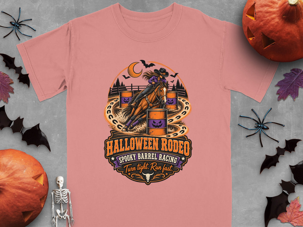 Halloween Rodeo graphic on pink t-shirt with barrel racing, bats, and pumpkins.