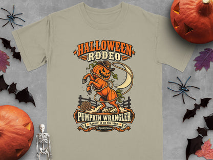 T-shirt with Halloween Rodeo graphic of a pumpkin horse, lasso, and moon.