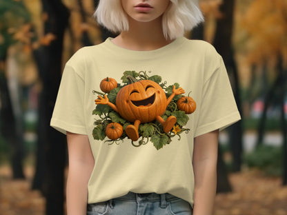 Light yellow t-shirt with a cheerful cartoon pumpkin surrounded by smaller pumpkins and leaves.