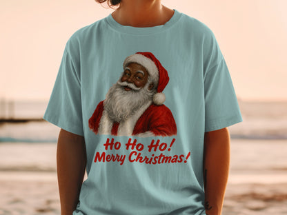 Light blue t-shirt with a black Santa graphic and red text "Ho Ho Ho! Merry Christmas!"