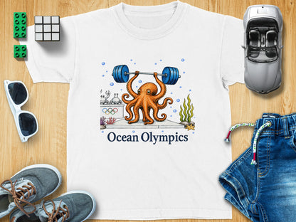 White t-shirt with an octopus lifting weights and text "Ocean Olympics".
