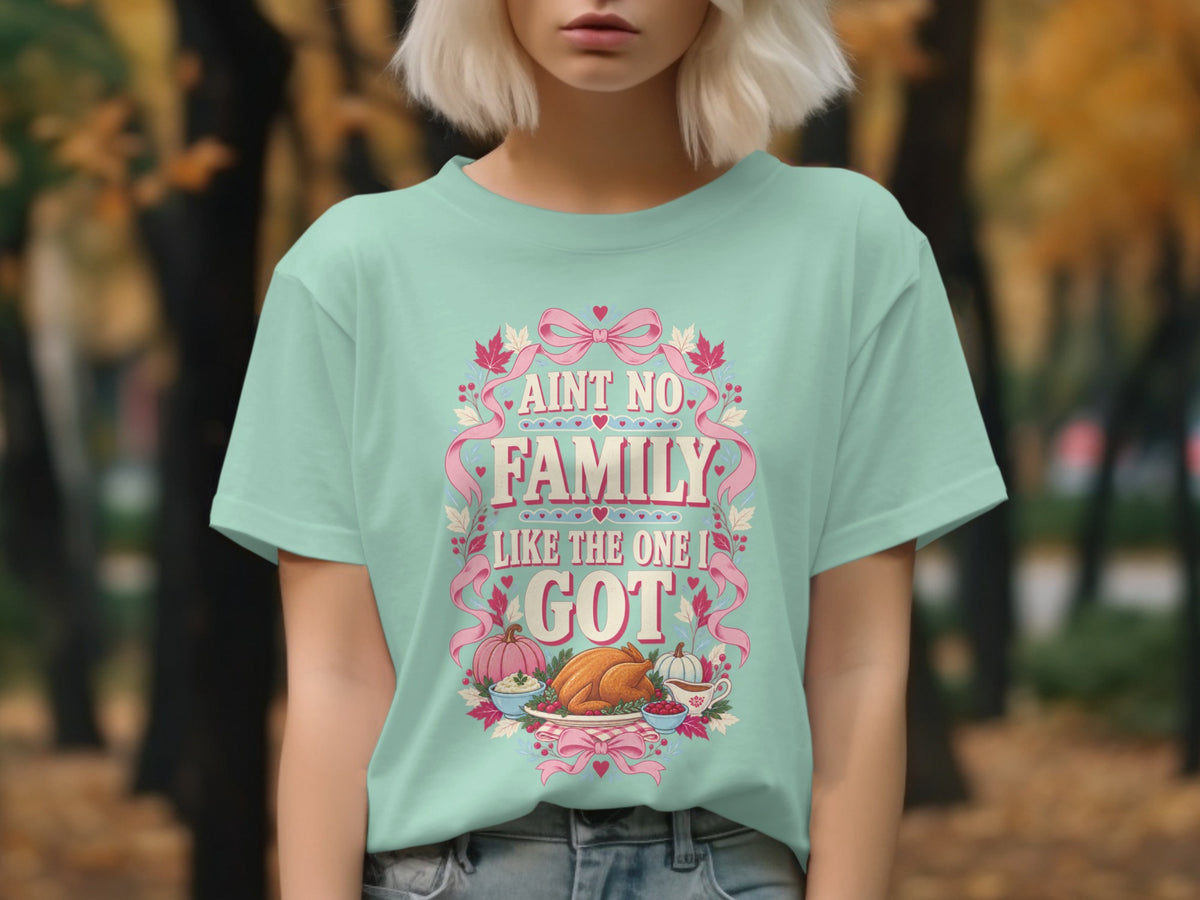 Mint t-shirt with "Ain't no family like the one I got" and Thanksgiving food graphics.