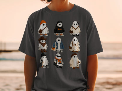Nine illustrated ghosts in various outfits on a t-shirt.