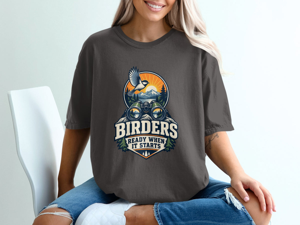 Dark t-shirt with "BIRDERS READY WHEN IT STARTS" graphic and nature scene.