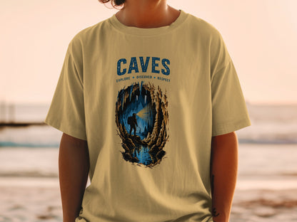T-shirt graphic with "CAVES" text, explore discover respect, and a spelunker in a cave.
