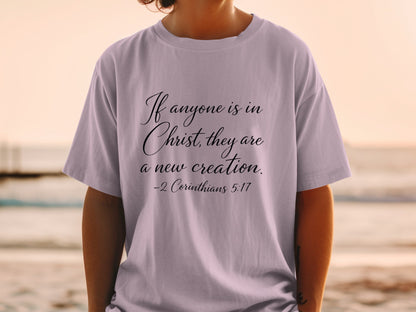 T-shirt with black script text "If anyone is in Christ, they are a new creation. -2 Corinthians 5:17"