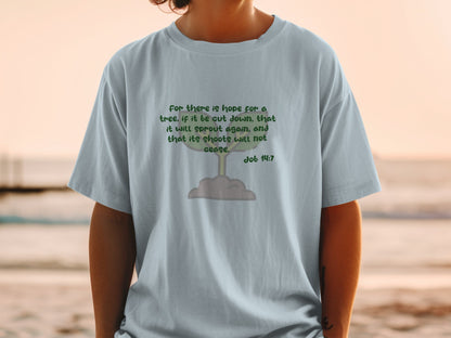 T-shirt with green text and a simple tree graphic referencing Job 14:7.