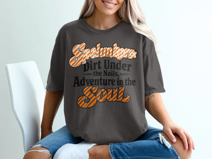Dark gray t-shirt with "Spelunkers Dirt Under the Nails, Adventure in the Soul" text.