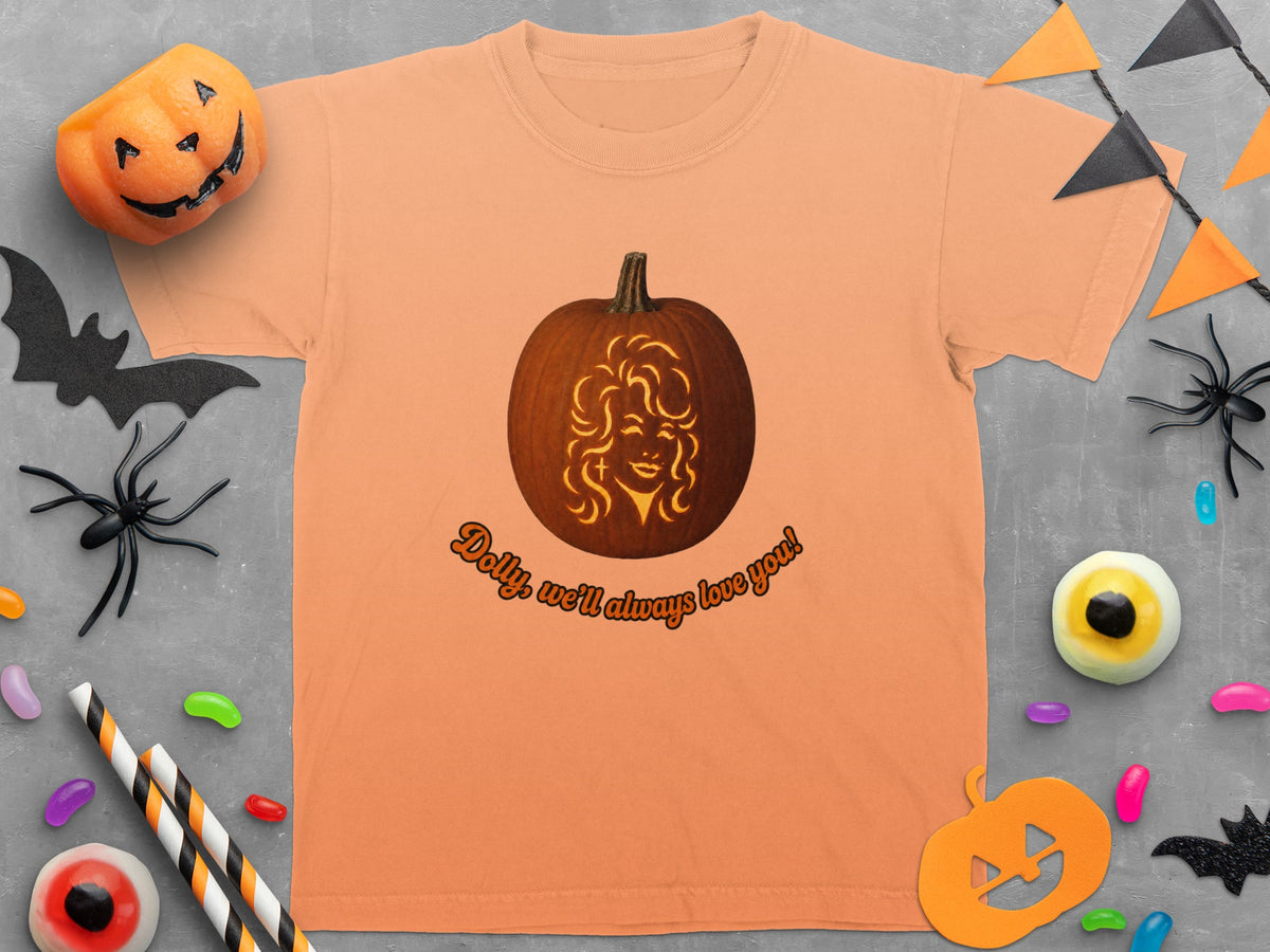 Orange t-shirt with a pumpkin carved with Dolly Parton's face and text.