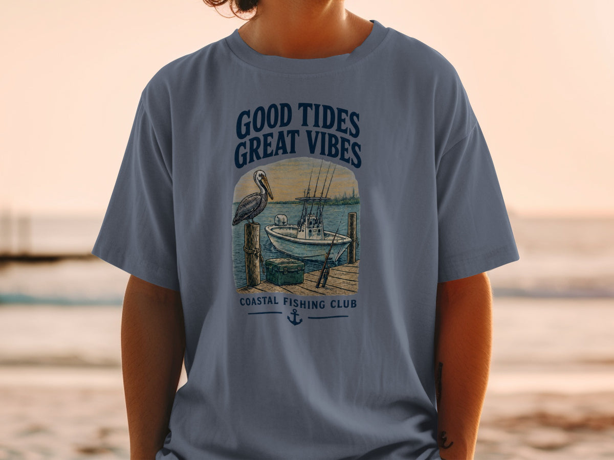T-shirt with "Good Tides Great Vibes" and a coastal fishing scene.