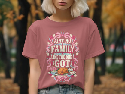 Rose t-shirt with "Aint no family like the one I got" and Thanksgiving meal graphic.