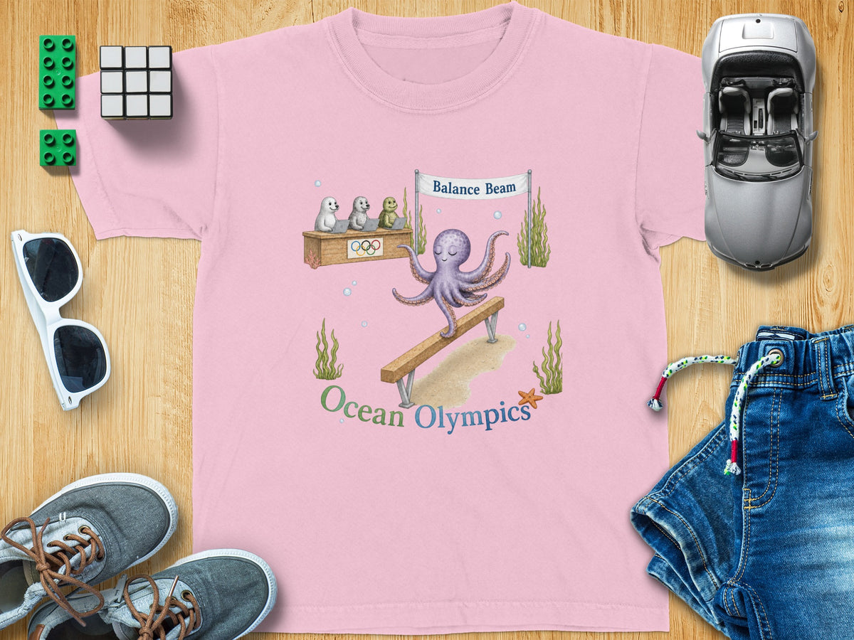 Pink t-shirt with octopus on balance beam and text "Ocean Olympics."
