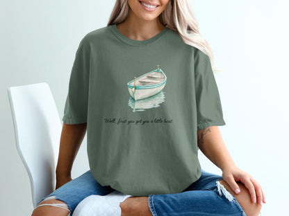 Green t-shirt with watercolor rowboat and text "Well, first you get you a little boat."