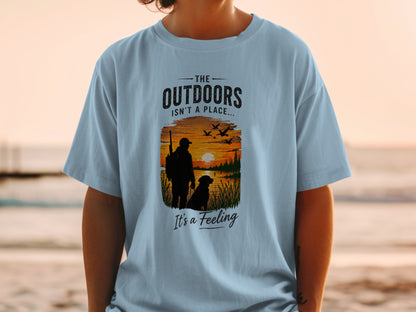 T-shirt graphic with text "The Outdoors Isn't a Place... It's a Feeling"