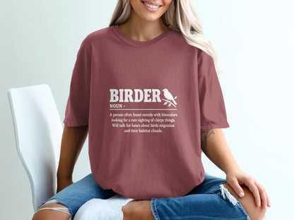 "Birder Noun" definition with a bird on a branch graphic on a maroon t-shirt.