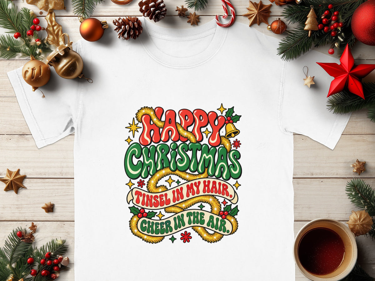 White t-shirt with "Happy Christmas, Tinsel in my hair, Cheer in the air" festive graphic.