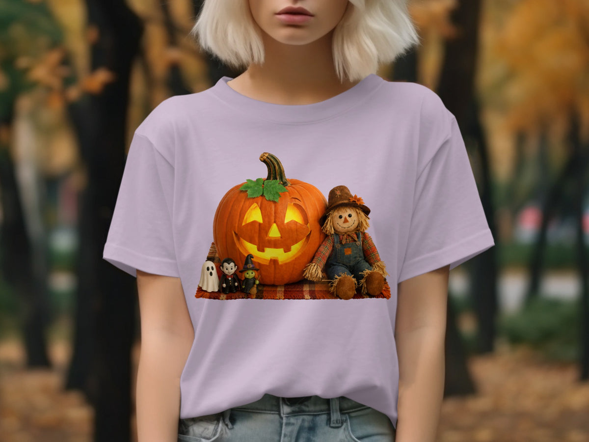 Halloween graphic on a light purple t-shirt featuring a jack-o'-lantern, scarecrow, and spooky figures.