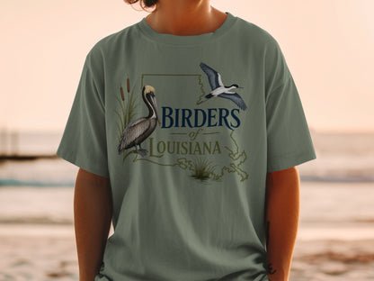 Birders of Louisiana t-shirt featuring a pelican and bird on Louisiana state outline.