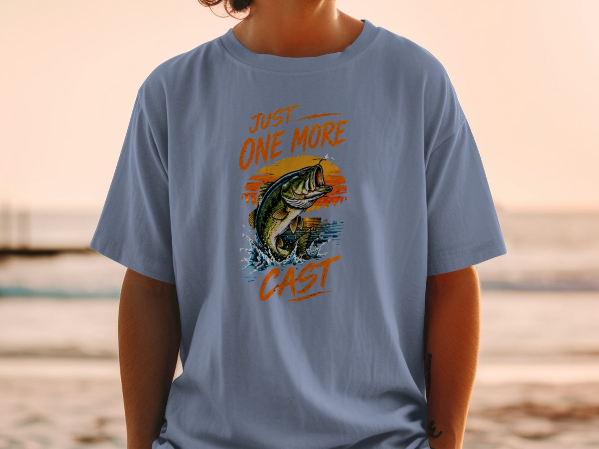 Bass jumping from water with text "JUST ONE MORE CAST" at sunset.