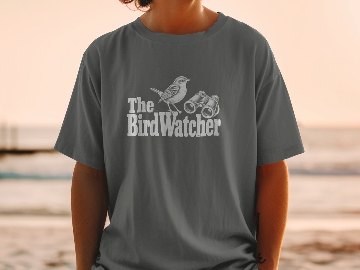 T-shirt graphic with a bird and binoculars, reading "The BirdWatcher."