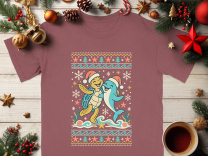 Cartoon turtle and dolphin in Santa hats embrace on a wave, surrounded by snowflakes and sea elements.