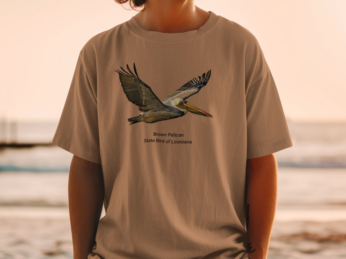 Brown pelican, state bird of Louisiana, depicted on a tan t-shirt.