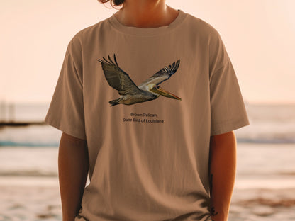 Brown pelican, state bird of Louisiana, depicted on a tan t-shirt.