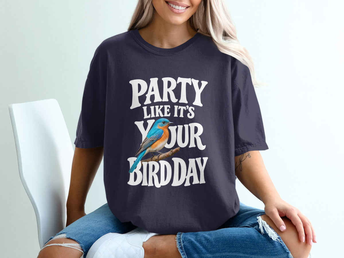 Navy t-shirt with white text reading "PARTY LIKE IT'S YOUR BIRDDAY" and a blue bird illustration.