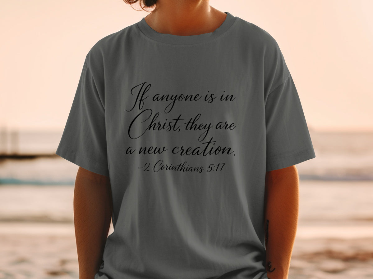 Gray t-shirt with "If anyone is in Christ, they are a new creation. -2 Corinthians 5:17"