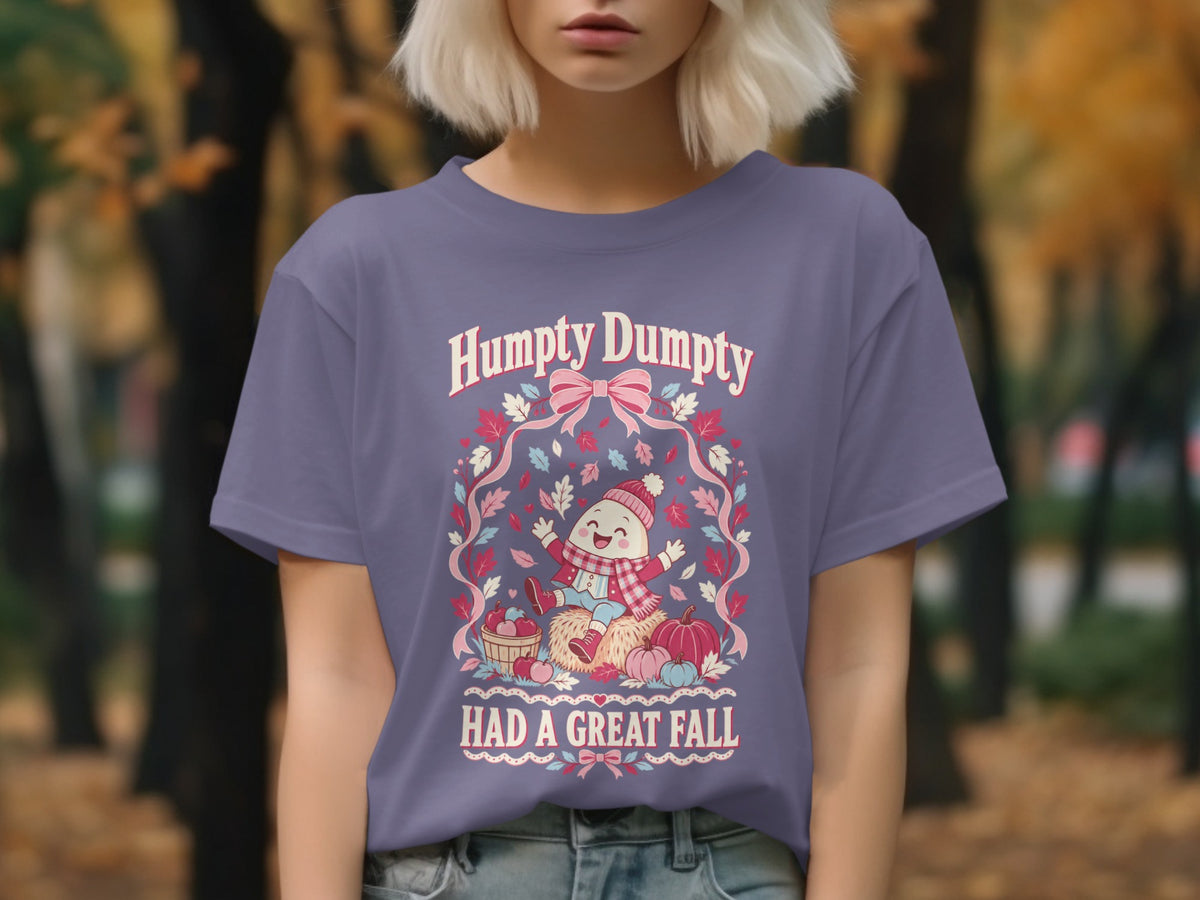 Humpty Dumpty Had a Great Fall graphic on a purple t-shirt with autumn elements.