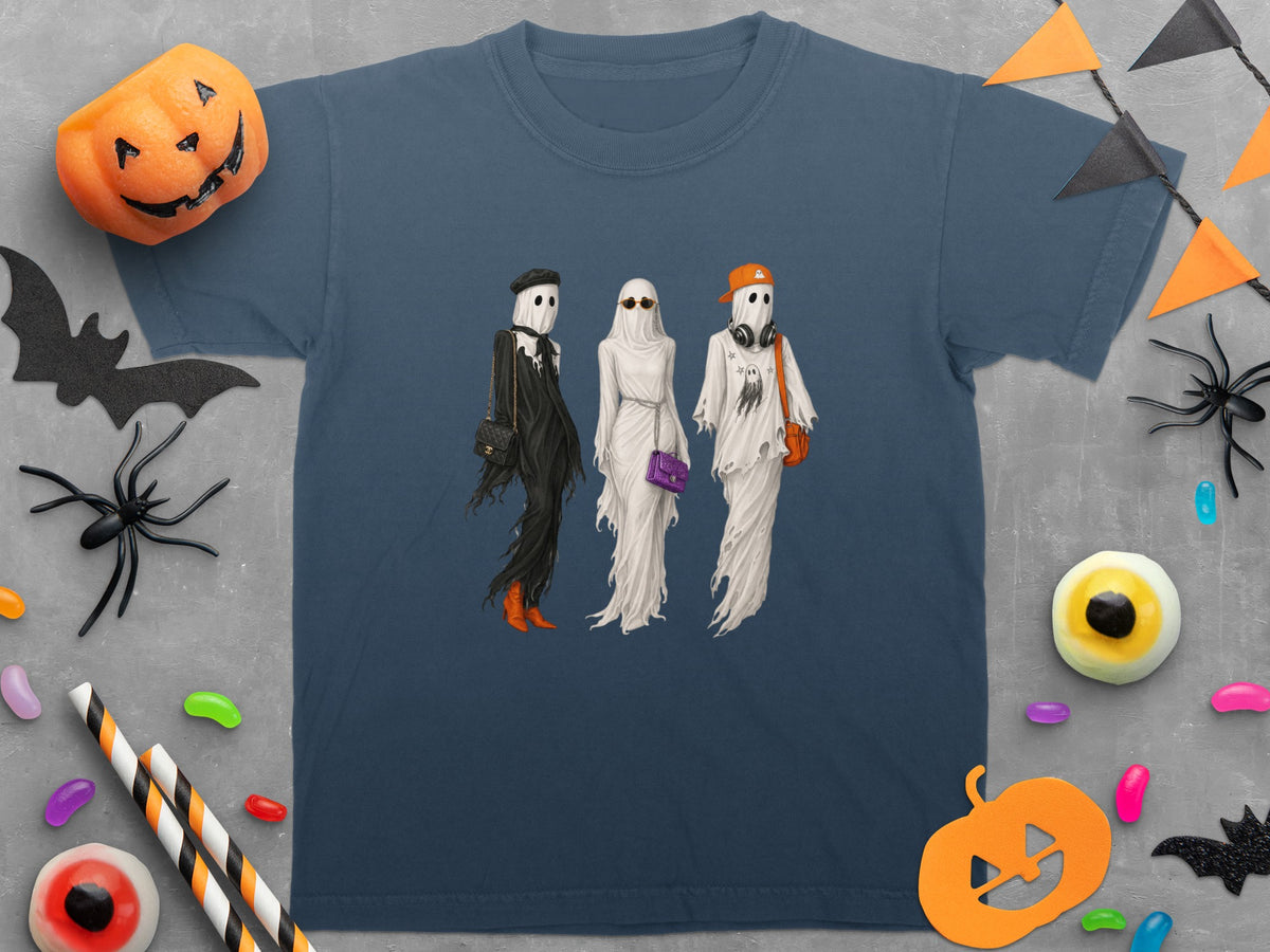 T-shirt with three stylish ghosts in Halloween-themed attire and decorations.