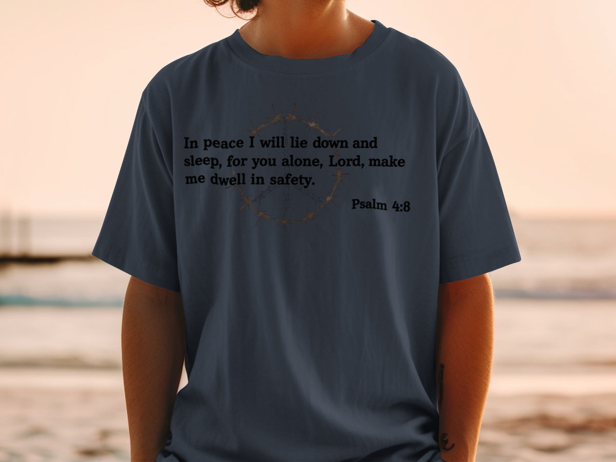 Dark blue t-shirt with "In peace I will lie down and sleep, for you alone, Lord, make me dwell in safety. Psalm 4:8" and a crown of thorns graphic.