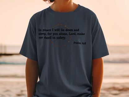 Dark blue t-shirt with "In peace I will lie down and sleep, for you alone, Lord, make me dwell in safety. Psalm 4:8" and a crown of thorns graphic.