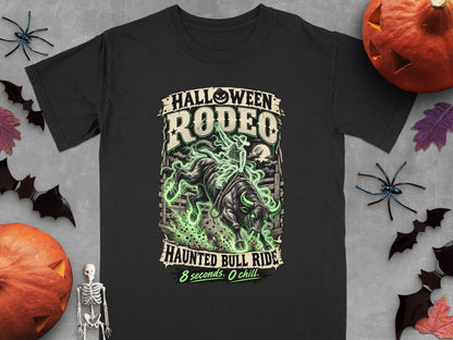 Black t-shirt with Halloween Rodeo Haunted Bull Ride graphic, featuring a cowboy on a bull surrounded by green mist.