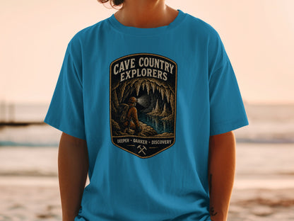 Blue t-shirt with "Cave Country Explorers" and cave exploration graphic.