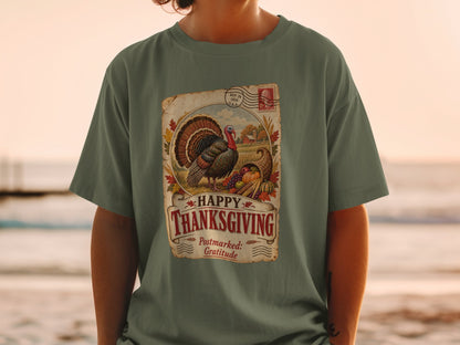 Green t-shirt with vintage Thanksgiving graphic featuring a turkey, cornucopia, and farm scene.