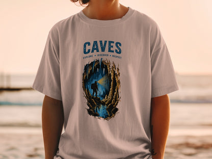 T-shirt with "CAVES EXPLORE DISCOVER RESPECT" graphic and cave explorer scene.