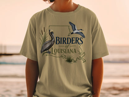 T-shirt graphic: "Birders of Louisiana" text with pelican, flying bird, and Louisiana outline.