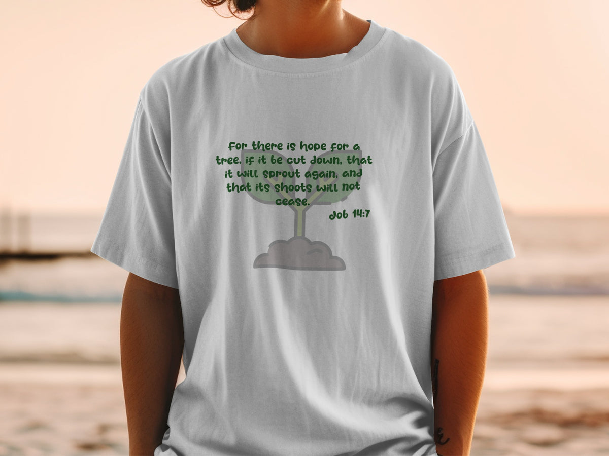 White t-shirt with green text from Job 14:7 and a sprout illustration.