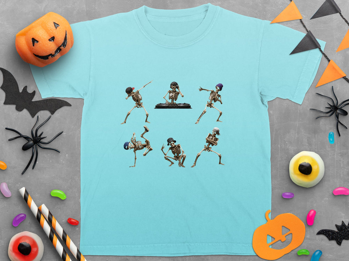 Six skeletons dancing and DJing on a light blue t-shirt.