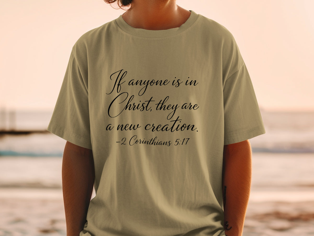 Olive t-shirt with "If anyone is in Christ, they are a new creation. -2 Corinthians 5:17"
