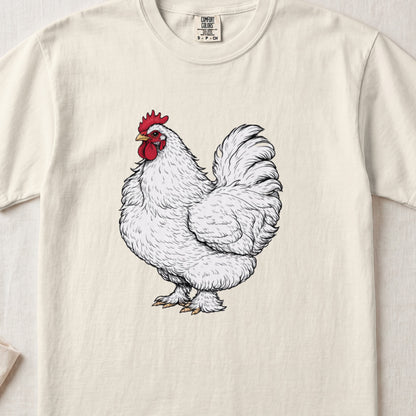 A cream-colored t-shirt with a detailed black ink drawing of a white rooster with a red comb.