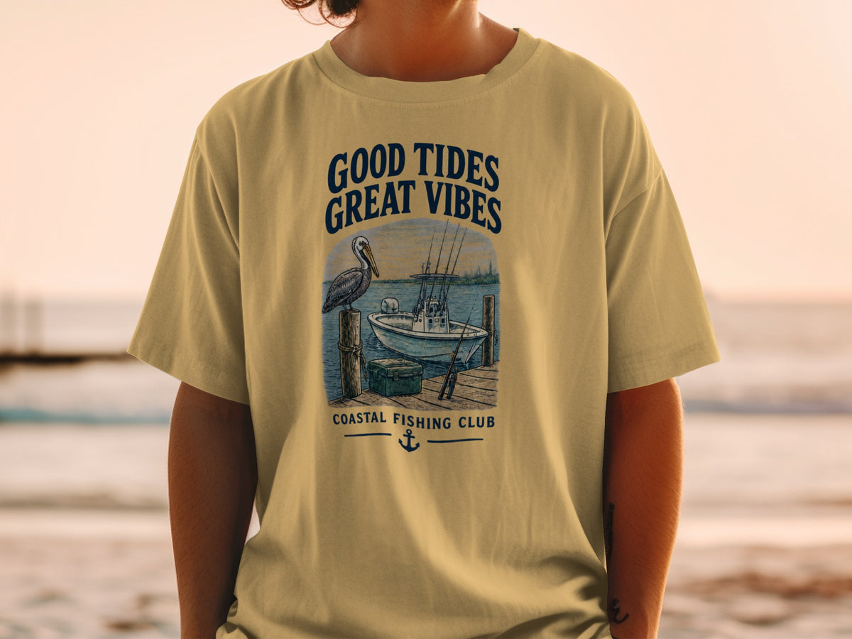 T-shirt graphic with text "Good Tides Great Vibes" and a fishing scene.