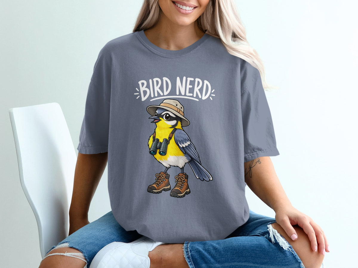 T-shirt graphic with cartoon bird wearing hat, binoculars, and hiking boots with text "BIRD NERD".