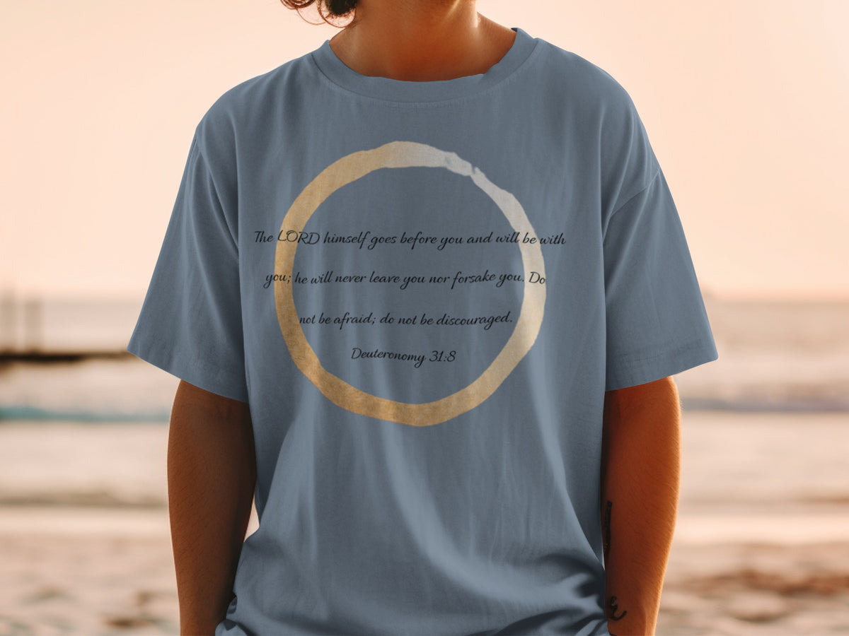 Blue t-shirt with Deuteronomy 31:8 quote inside a golden ring.