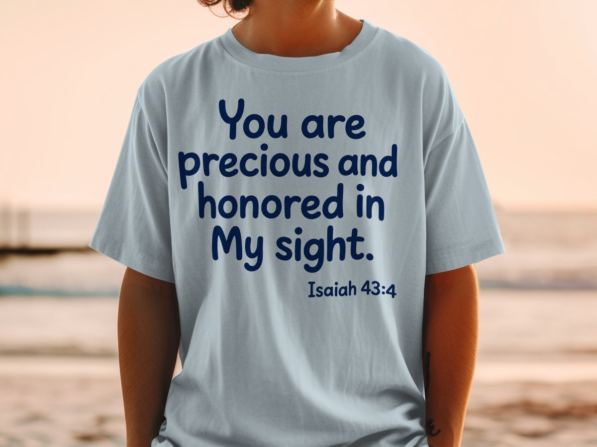 Light blue t-shirt with navy text "You are precious and honored in My sight. Isaiah 43:4".