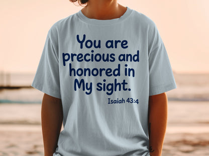 Light blue t-shirt with navy text "You are precious and honored in My sight. Isaiah 43:4".