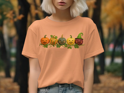 Five smiling carved pumpkins on a vine with a Halloween theme.