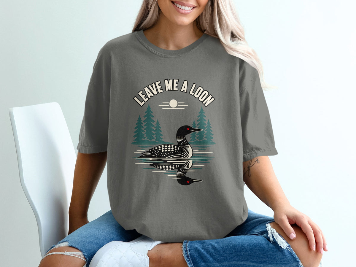 T-shirt with "Leave Me a Loon" text and loon on water graphic.