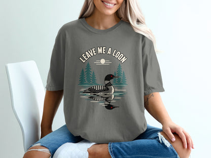 T-shirt with "Leave Me a Loon" text and loon on water graphic.